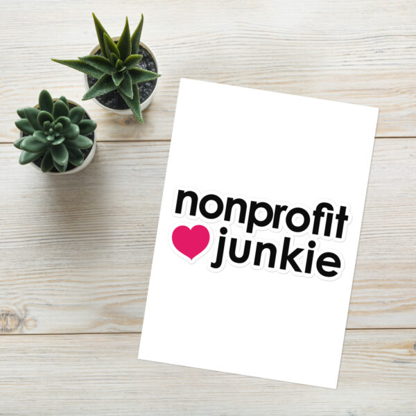 Sticker sheet in black text that says nonprofit junkie in regular arial like font next to a pink heart