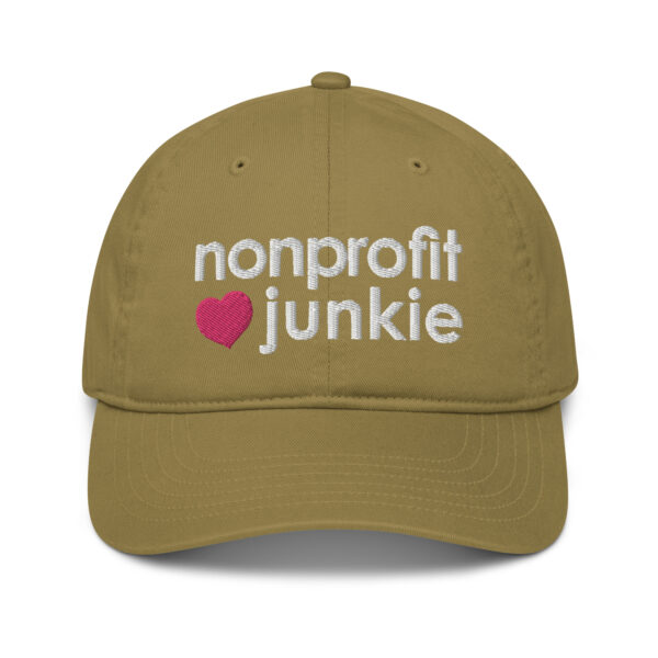 Jungle organic dad hat, white text on one side says nonprofit junkie in regular arial like font next to a pink heart