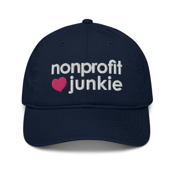 Pacific organic dad hat, white text on one side says nonprofit junkie in regular arial like font next to a pink heart