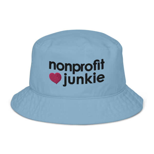 Slate blue bucket hat, black text on one side says nonprofit junkie in regular arial like font next to a pink heart