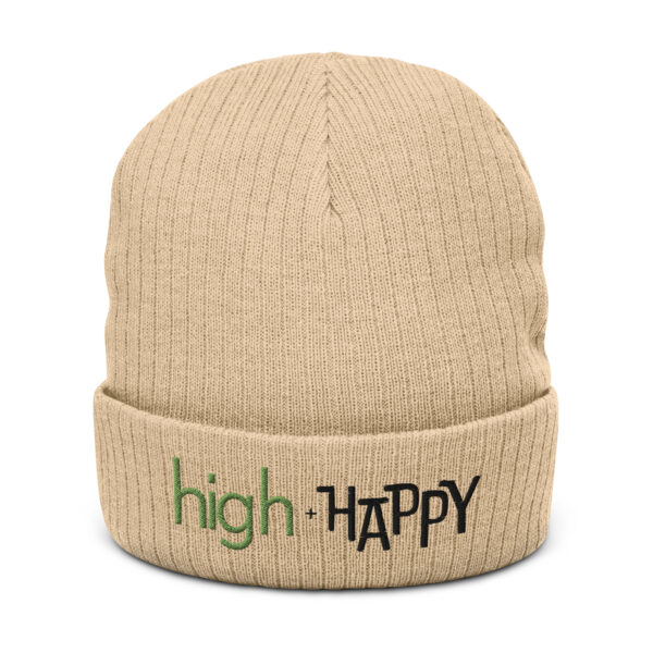 Beige ribbed knit beanie, green and black text on one side says high + happy in regular arial like font