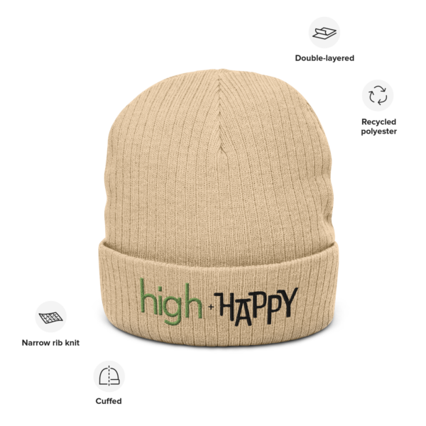 Beige ribbed knit beanie, green and black text on one side says high + happy in regular arial like font