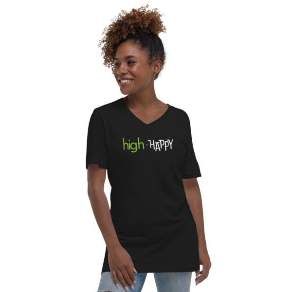 Unisex black v neck tee, green and white text on one side says high + happy in regular arial like font, on a woman