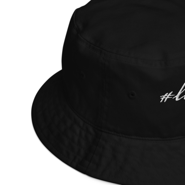 Black organic bucket hat, up close view of product details