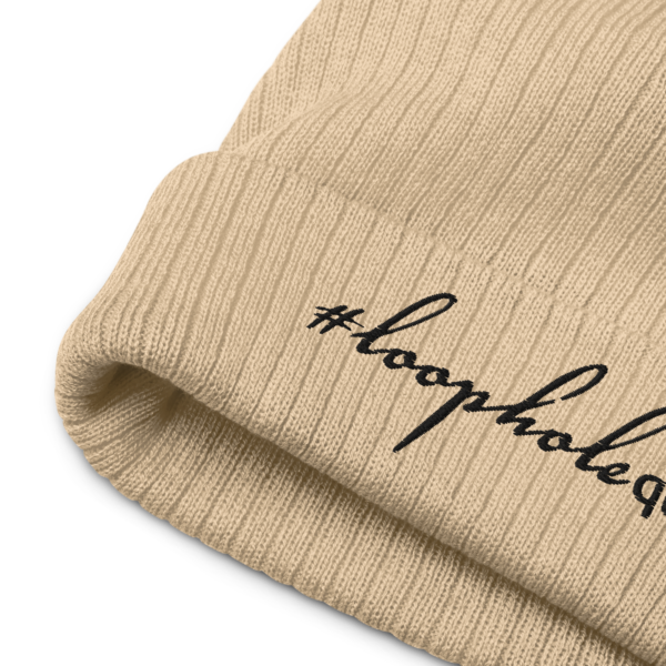 Beige ribbed knit beanie, black text on one side says hashtag loophole queen written in italic cursive like font