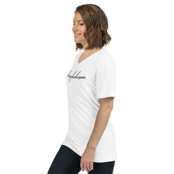 Unisex white v neck tee, black text on one side says hashtag loophole queen in cursive like font and regular arial like font on a woman