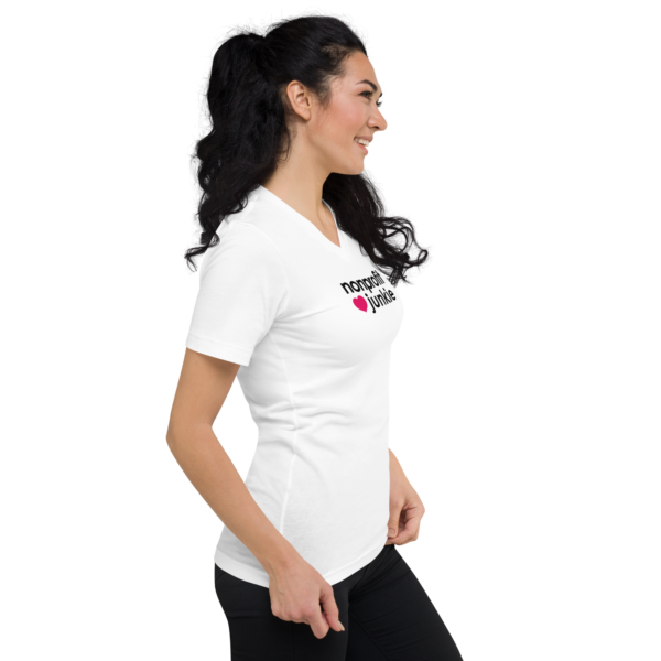 Unisex white v neck t shirt, black text on one side says nonprofit junkie in regular arial font next to a pink heart on a woman