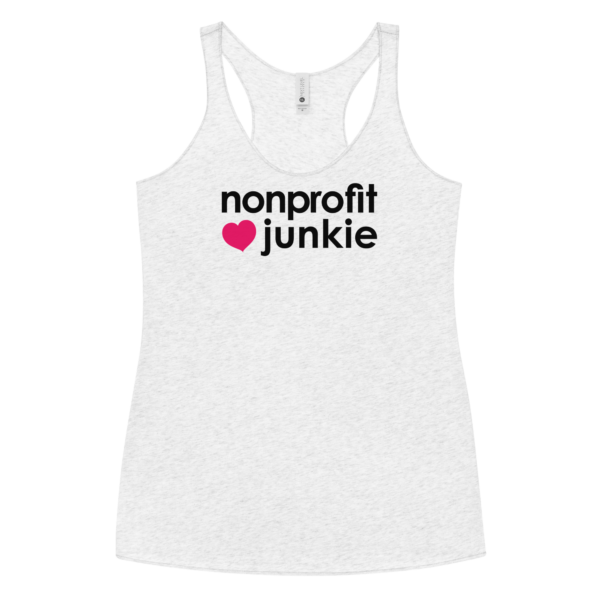 Womens heather white racerback tank, black text on one side says nonprofit junkie next to a pink heart