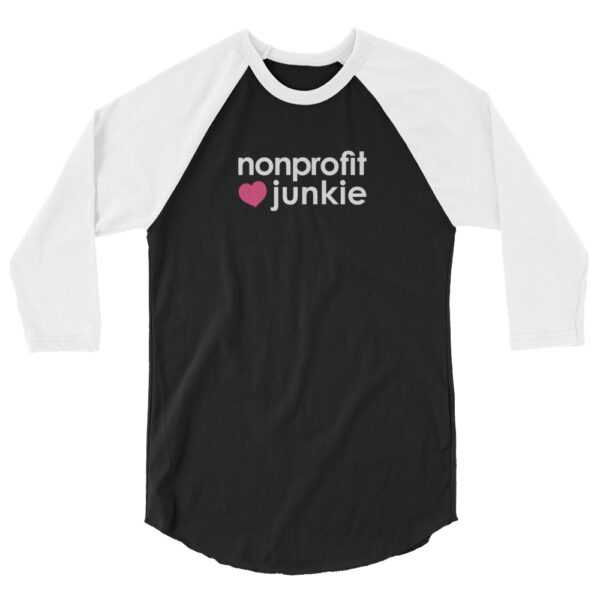 White 3 4th sleeve raglan shirt, black in middle, white text on one side says nonprofit junkie next to a pink heart