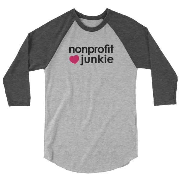 Heather charcoal 3 4th sleeve raglan shirt, heather grey in middle, black text on one side says nonprofit junkie next to a pink heart