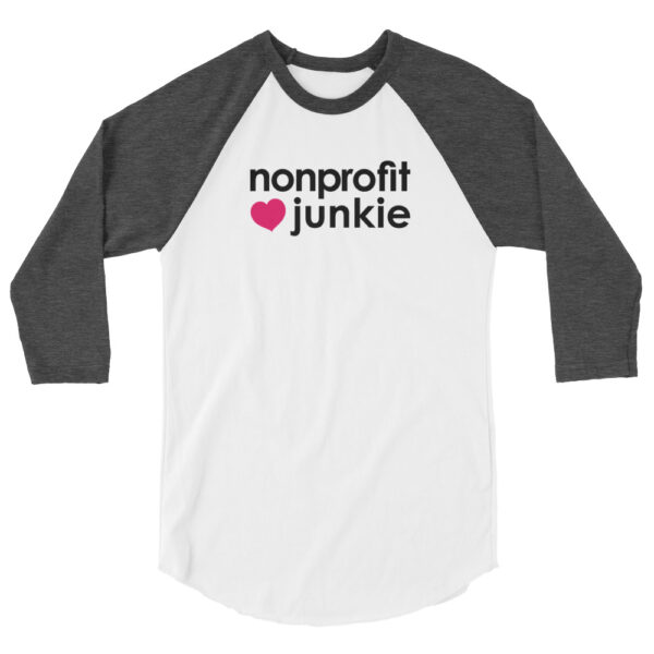 Heather charcoal 3 4th sleeve raglan shirt, white in middle, black text on one side says nonprofit junkie next to a pink heart