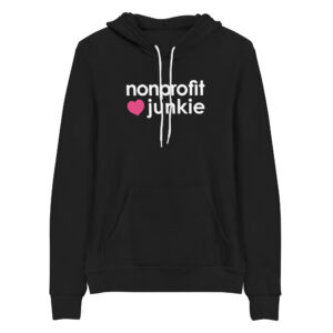 Unisex black pullover hoodie, white text on one side says nonprofit junkie in regular arial like font next to a pink heart