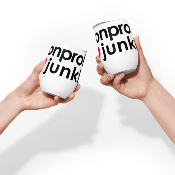 White wine tumbler with black text that says nonprofit junkie in regular arial like font next to a pink heart