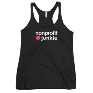 Womens vintage black racerback tank, white text on one side says nonprofit junkie next to a pink heart