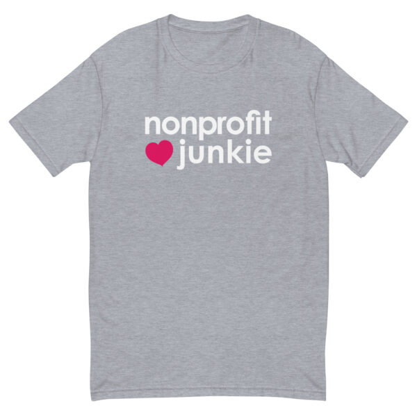 Mens heather grey fitted t shirt, white text on one side says nonprofit junkie next to a pink heart