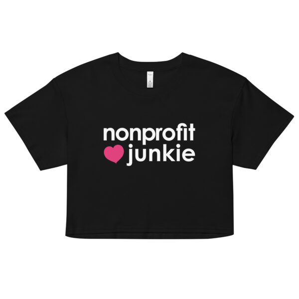 Womens black crop top, white text on one side says nonprofit junkie next to a pink heart in regular arial like font