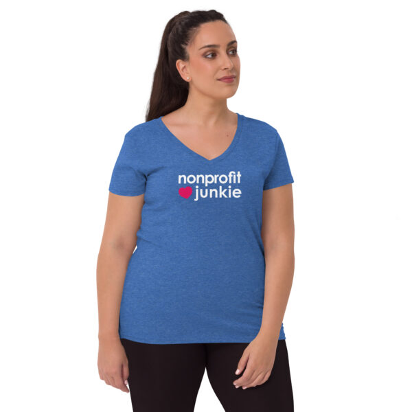 Womens heather blue recycled v neck t shirt, white text on one side says nonprofit junkie in regular arial font next to a pink heart on a woman