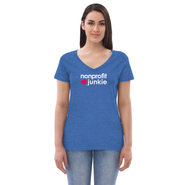 Womens heather blue v neck t shirt, white text on one side says nonprofit junkie in regular arial font next to a pink heart