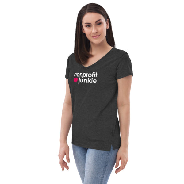 Womens charcoal heather v neck t shirt, white text on one side says nonprofit junkie in regular arial font next to a pink heart