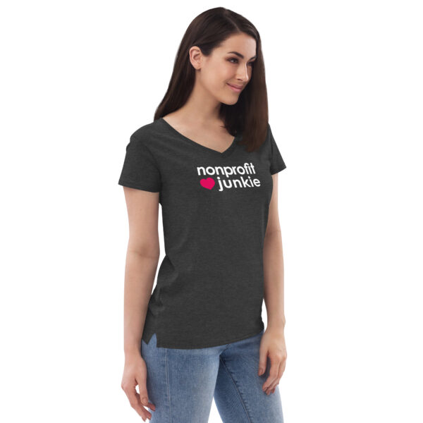 Womens charcoal heather v neck t shirt, white text on one side says nonprofit junkie in regular arial font next to a pink heart