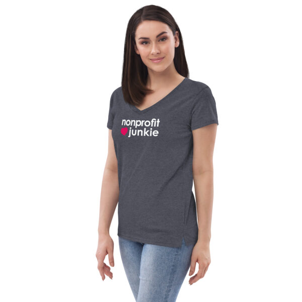 Womens heather navy v neck t shirt, white text on one side says nonprofit junkie in regular arial font next to a pink heart