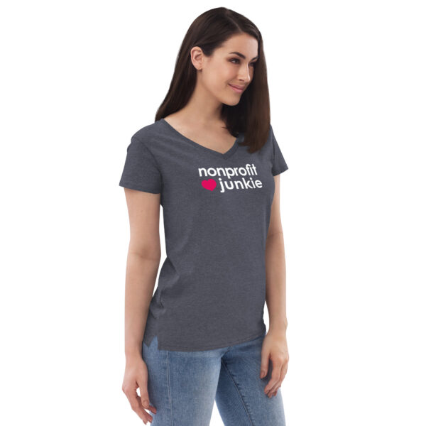 Womens heather navy v neck t shirt, white text on one side says nonprofit junkie in regular arial font next to a pink heart