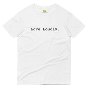 Unisex white t shirt, black text on one side says love loudly in regular arial like font