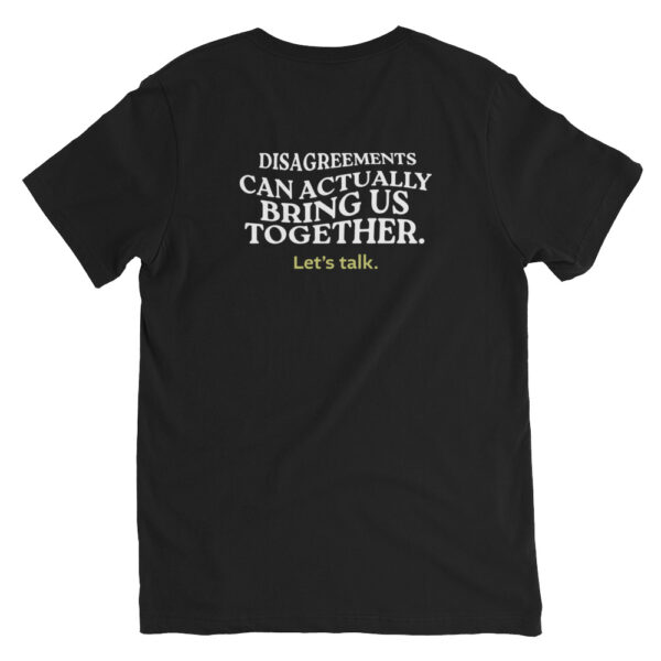 Unisex black v neck tee, white text on back side says disagreements can actually bring us together in wavy like font, green text says lets talk in regular arial like font